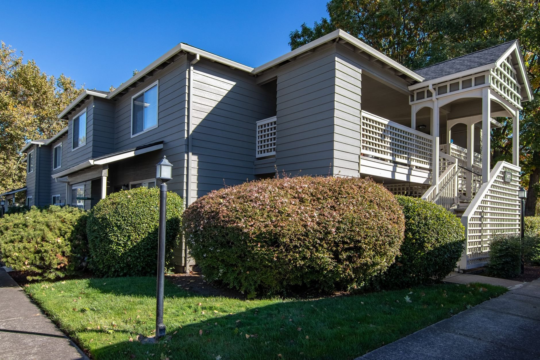 Well-maintained residential building with lush landscaping in the Pacific Northwest.